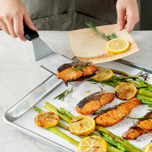 parchment paper on baking sheet with fish