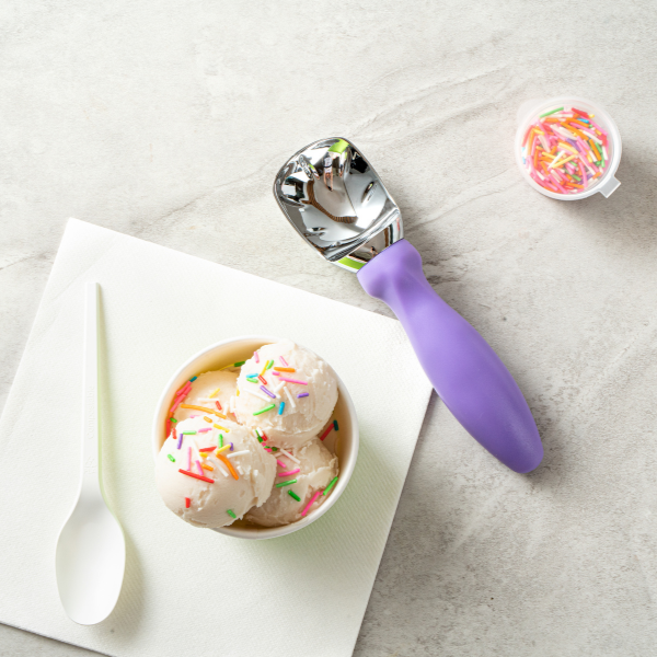 Ice cream scoop with ice cream and sprinkles